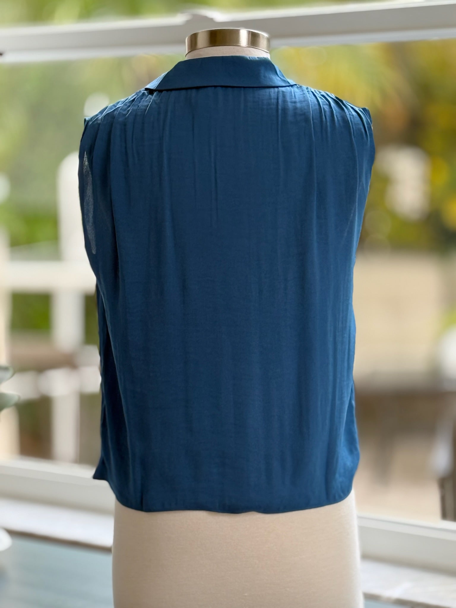 back of blue satin blouse