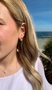 Model wearing haley gold earrings