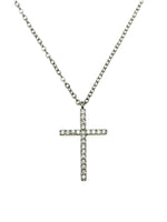 Pavé crystal cross pendant necklace on a silver chain against a white background