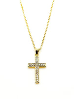 Gold cross necklace with diamonds on a white background