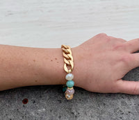 Kelsey beaded bracelet with gold chain on model.
