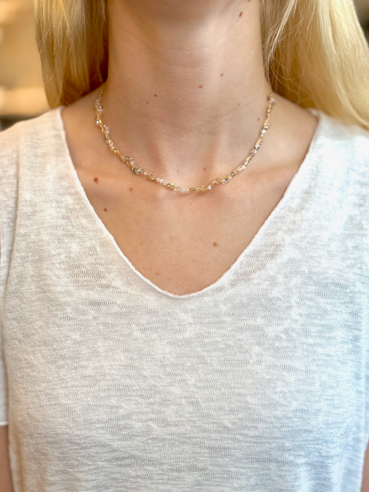 Necklace worn by a person with a neutral background