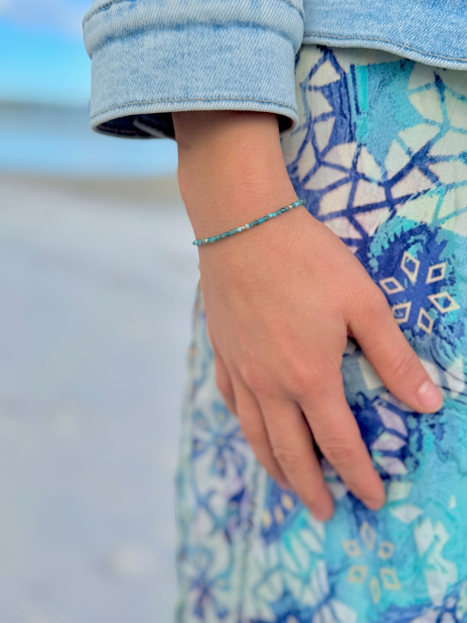 Model wearing Farah Apatite and Miyuki Bead Bracelet featuring sea-toned apatite beads and subtle Miyuki bead accents.