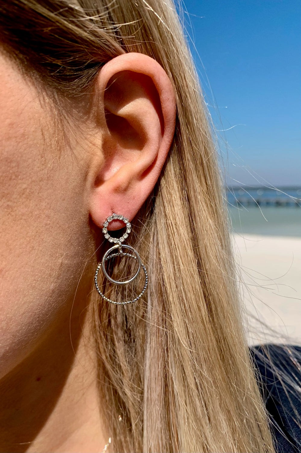 Kristy sparkle earring in silver on model. 