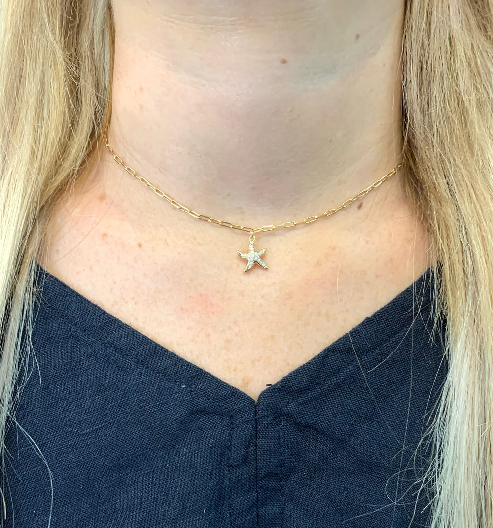 Jordan simple starfish necklace white on model.