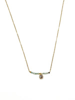 Ava Amazonite and Miyuki stainless steel necklace with light blue beads and a small crystal charm on a gold-toned chain.