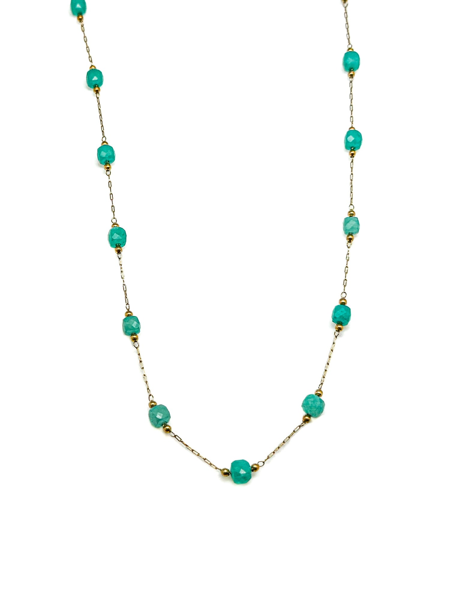 Turquoise beaded necklace on a white background