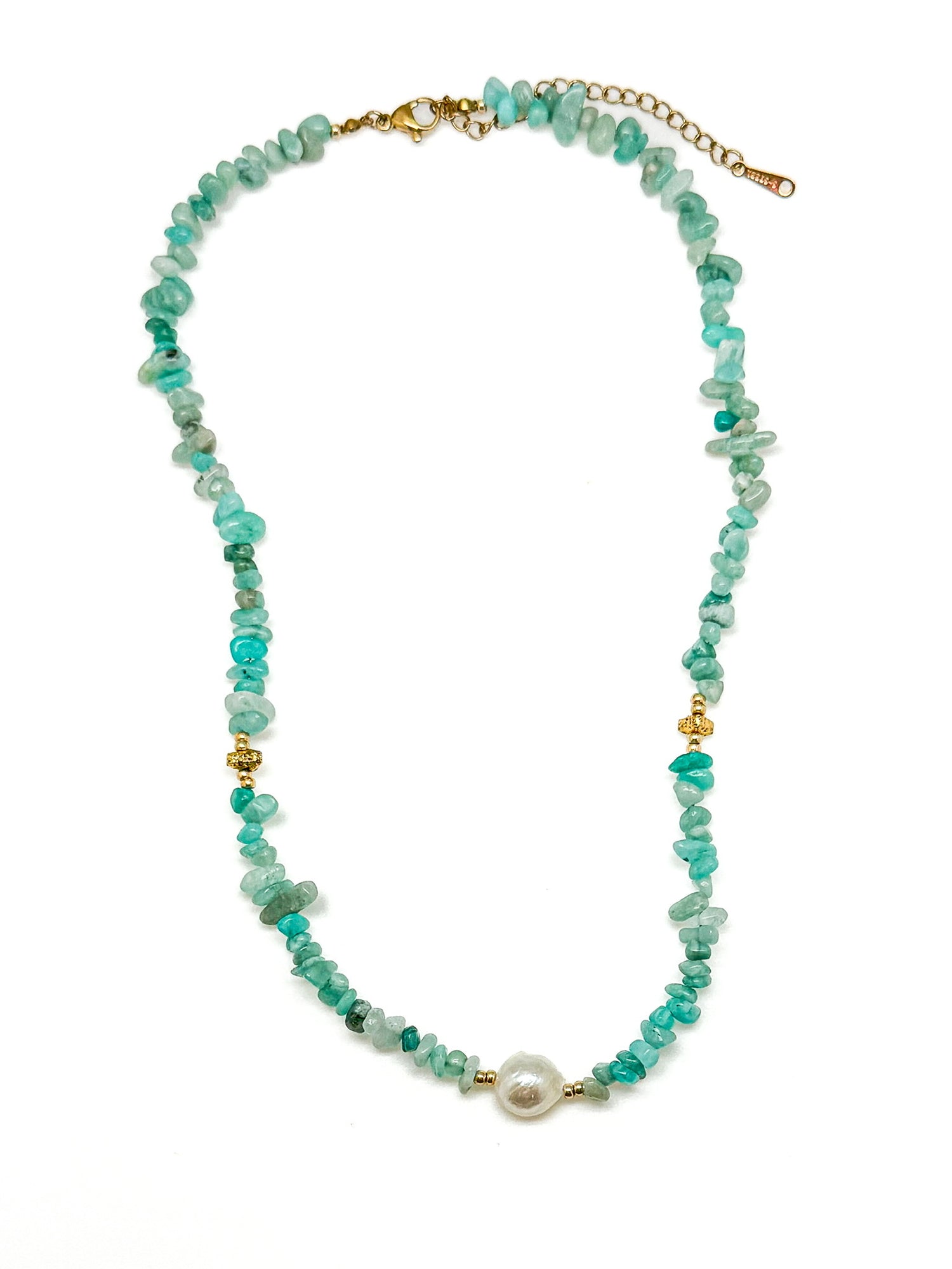 Necklace with green beads and a pearl on a white background