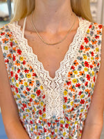 Eva Beaded Necklace with neutral beads and gold-tone accents on model neck 