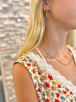 Eva Beaded Necklace with neutral beads and gold-tone accents on model neck side way photo 