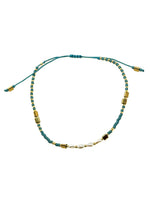 Gina Teal Pull Bracelet with teal beads, freshwater pearl center detail, gold-tone accents, and adjustable pull closure