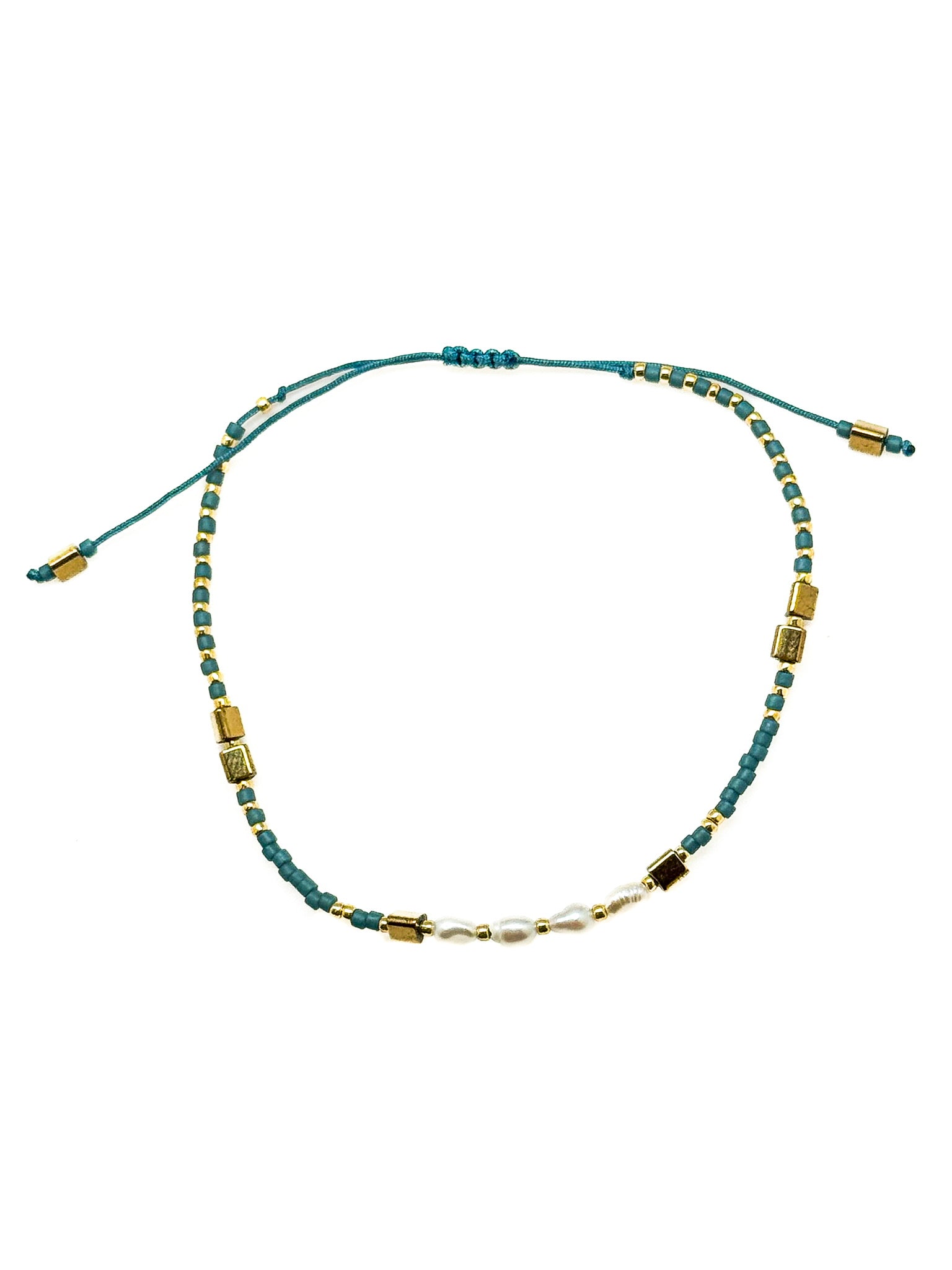 Gina Teal Pull Bracelet with teal beads, freshwater pearl center detail, gold-tone accents, and adjustable pull closure
