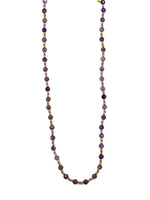 Necklace with purple beads on a white background
