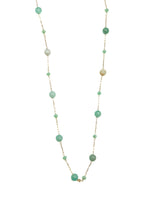 Delicate gold chain necklace with scattered light green, mint, and sea-glass toned beads, displayed on white background.