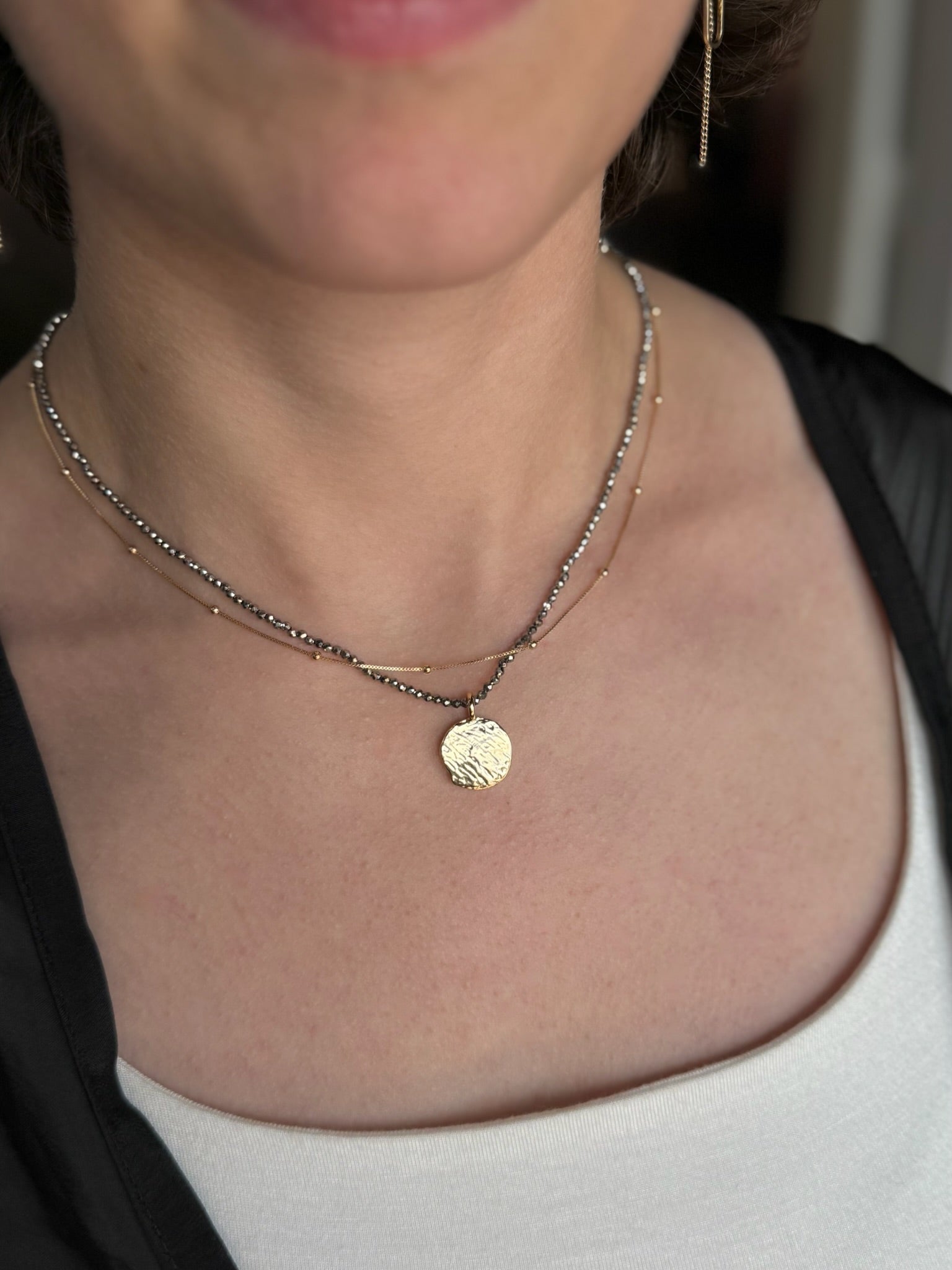 Selene Mixed chain gold necklace featuring a round hammered pendant