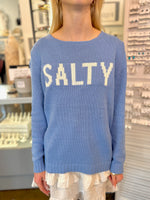 Person wearing a blue sweater with 'SALTY' text 