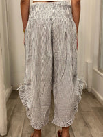 back view of woman wearing pants