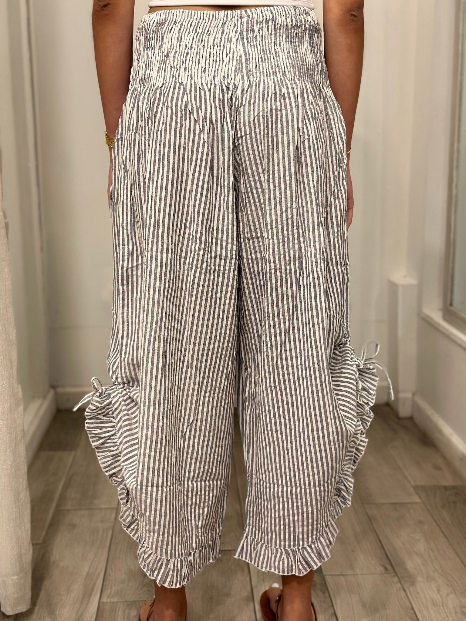 back view of woman wearing pants