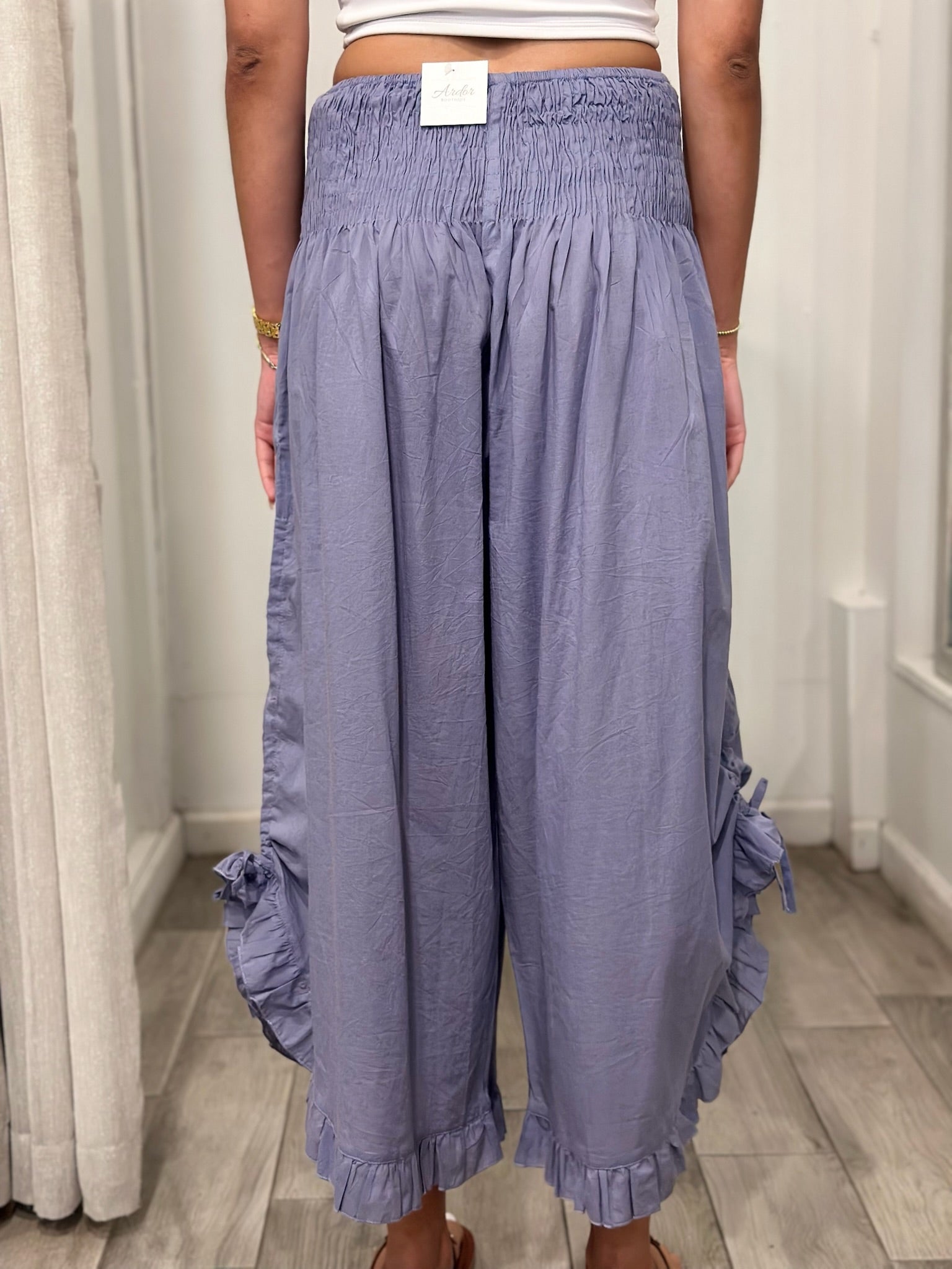 back view of  woman wearing one size pants