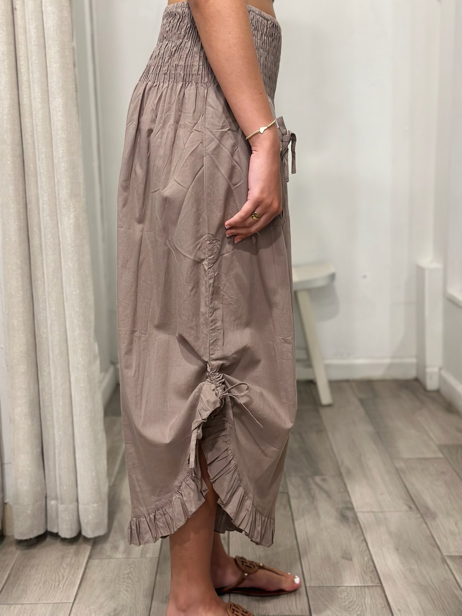 side view of woman wearing one size pants
