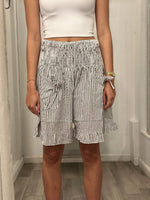 front view of woman in shorts