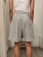 back view of one in shorts