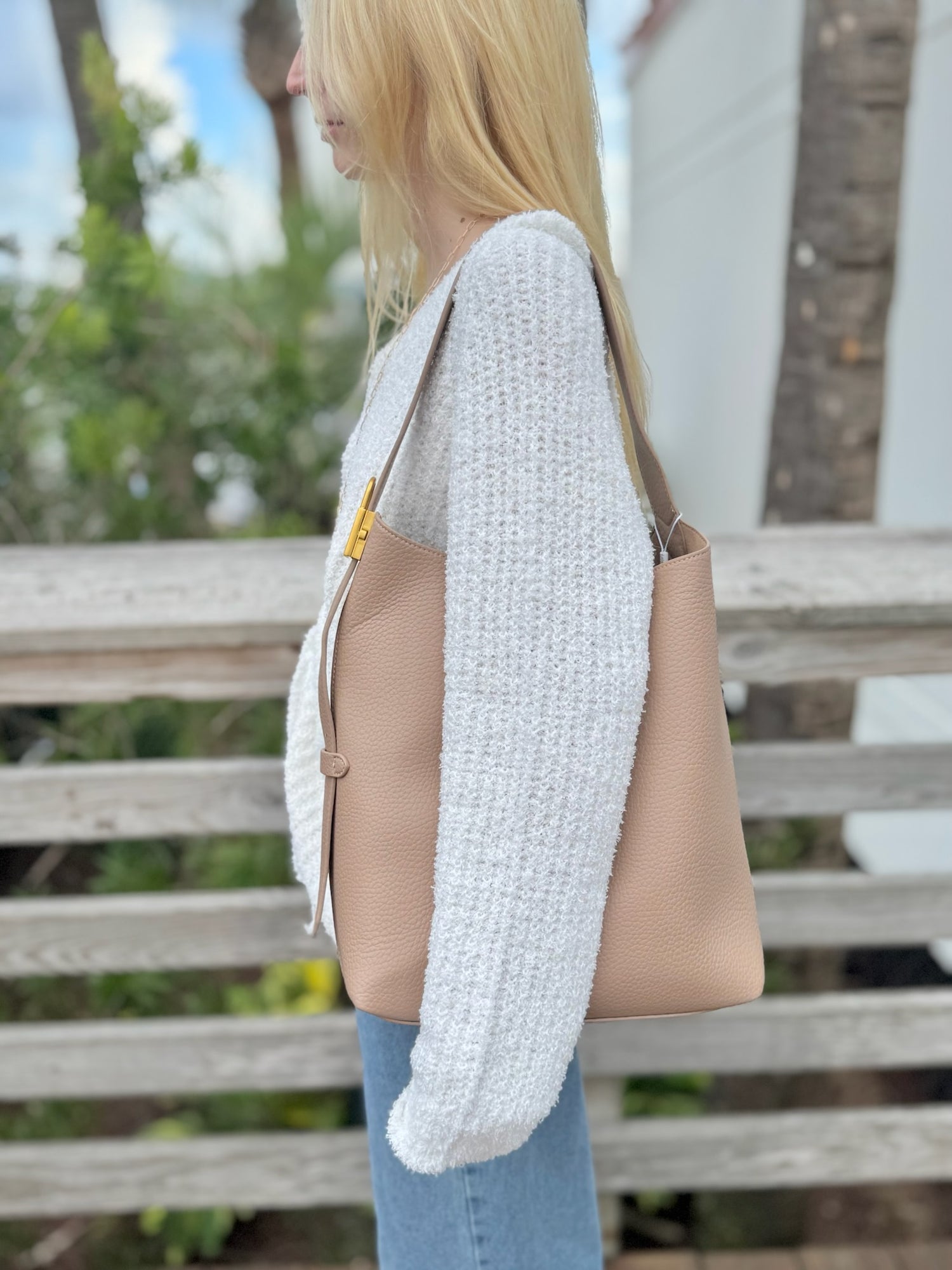 Jade bag in beige being worn 