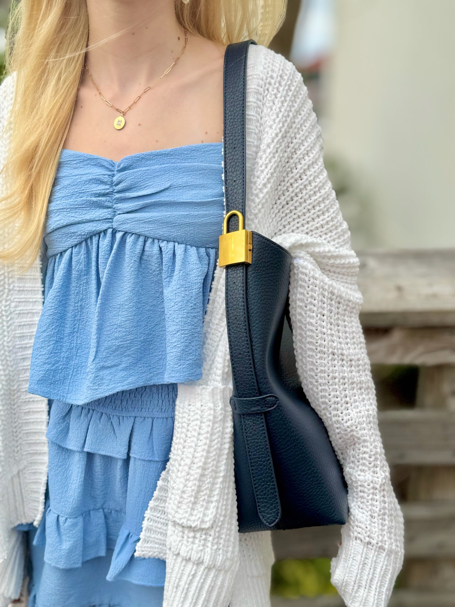 Jade bag in navy being worn 