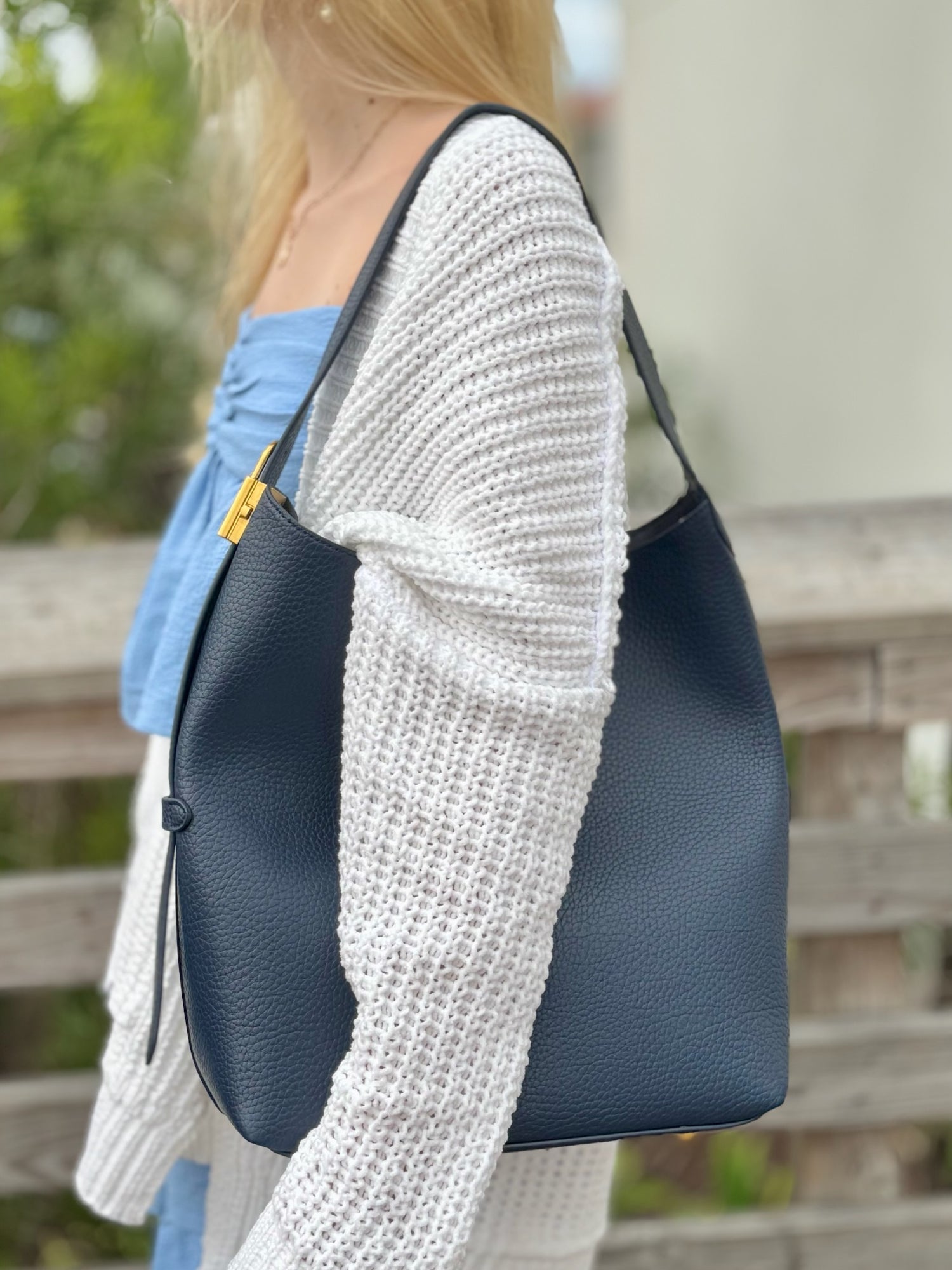 Jade bag in navy being worn