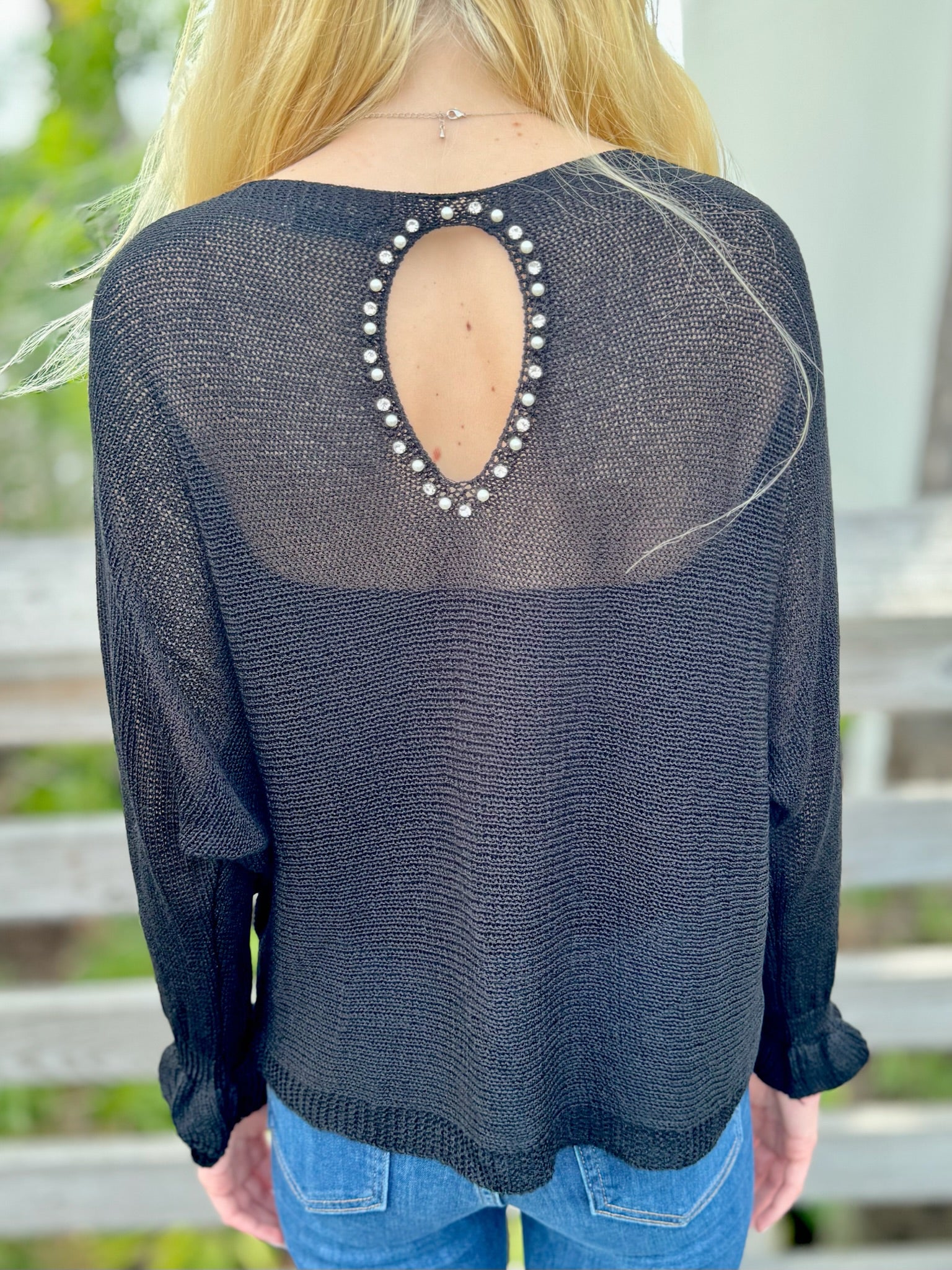 Black knit sweater back view