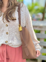 Jade bag in chocolate being worn 