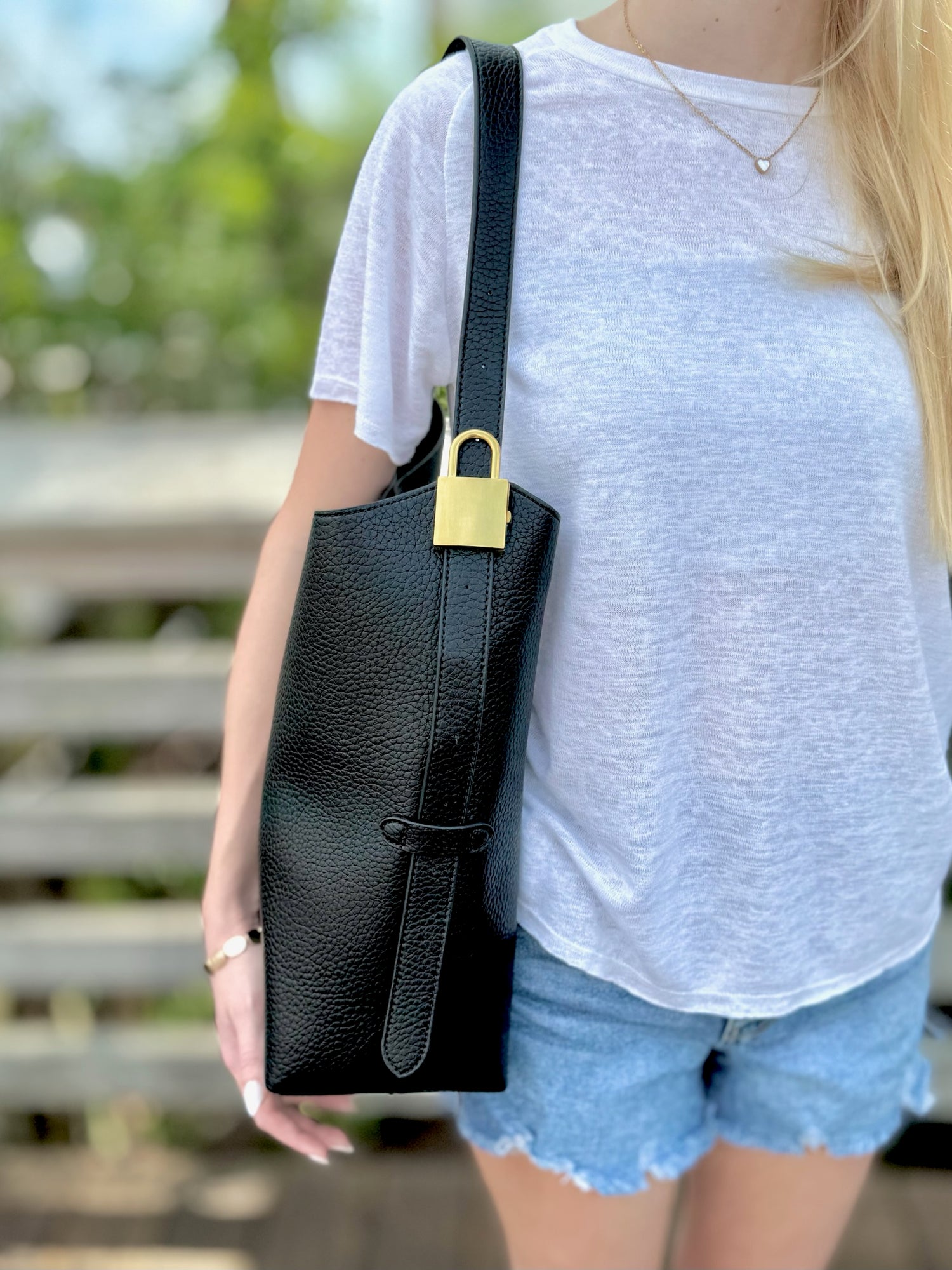 Jade bag in black being worn