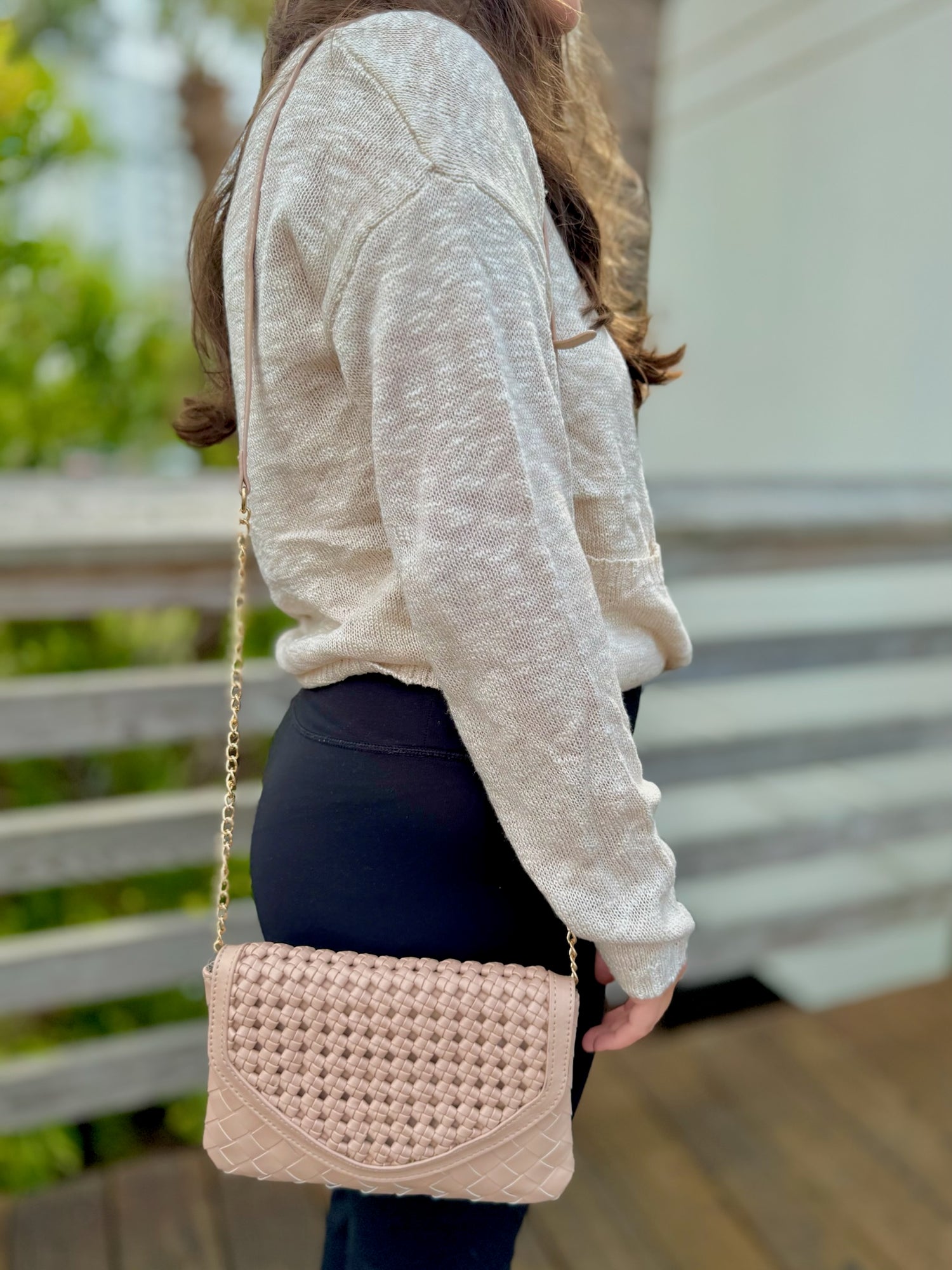 Korinne Crossbody bag in beige being worn
