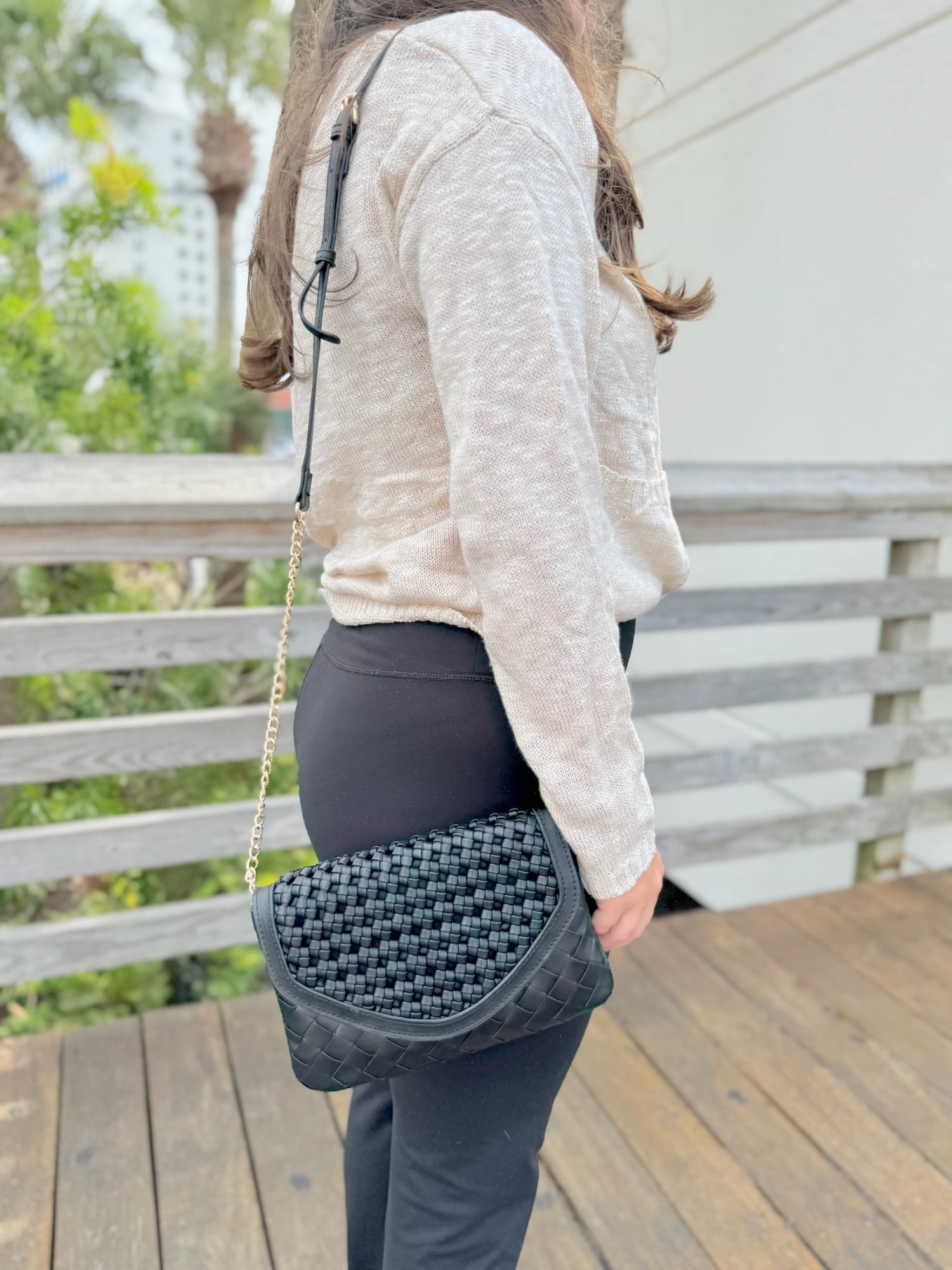Korinne crossbody in black being worn
