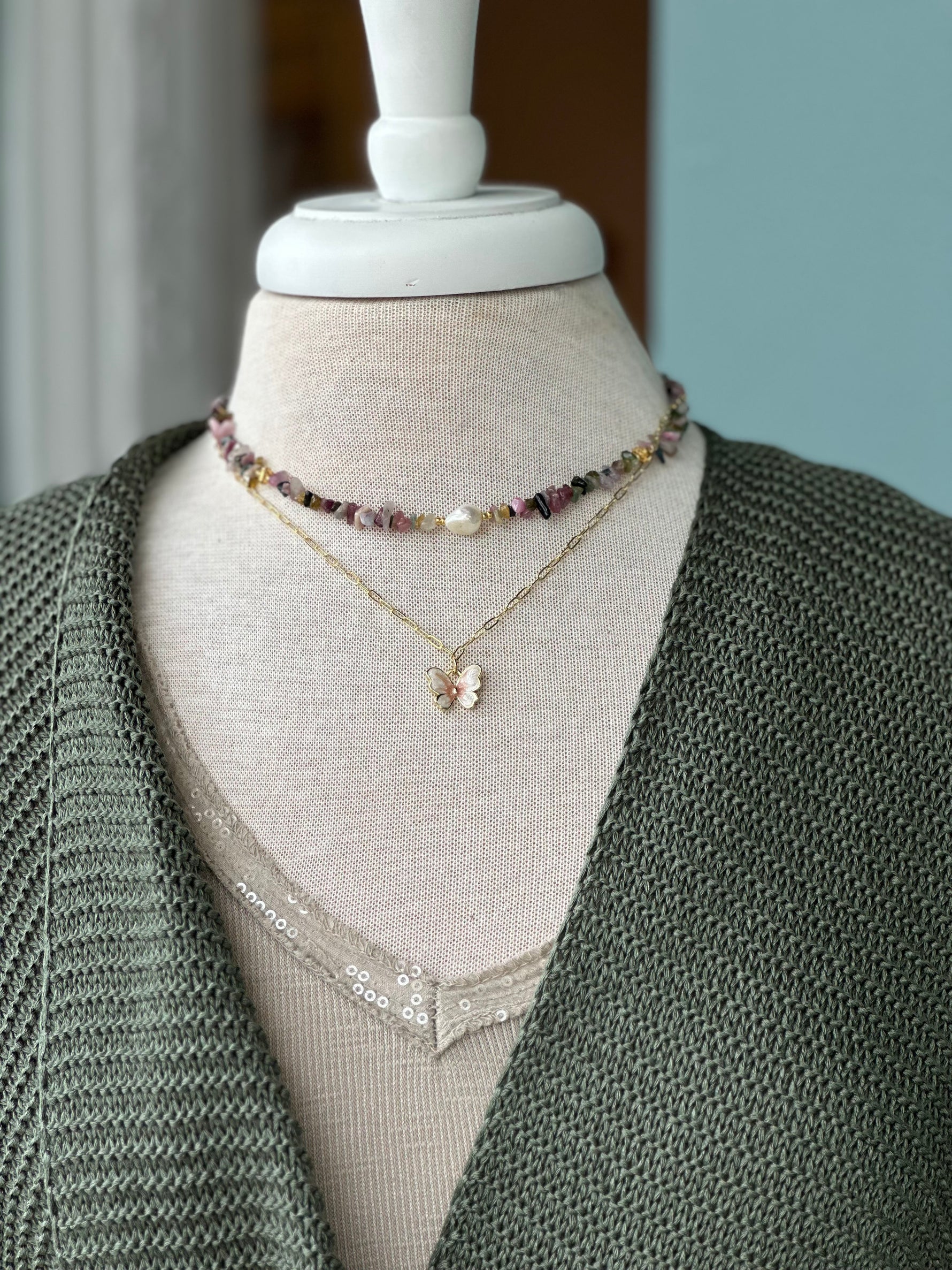 Jewelry shown layered as an outfit inso 