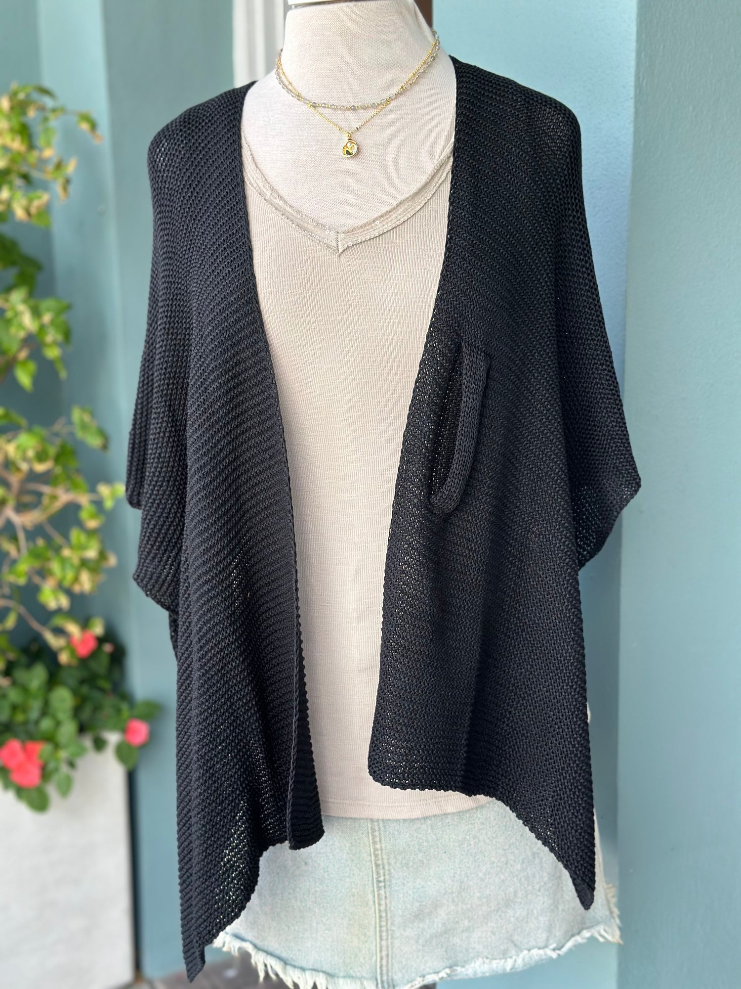Elise open wrap in black shown paired with jewelry at ardor boutique