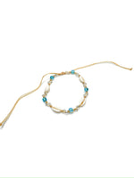 Anklet with white shells, blue beads, and clear crystals 