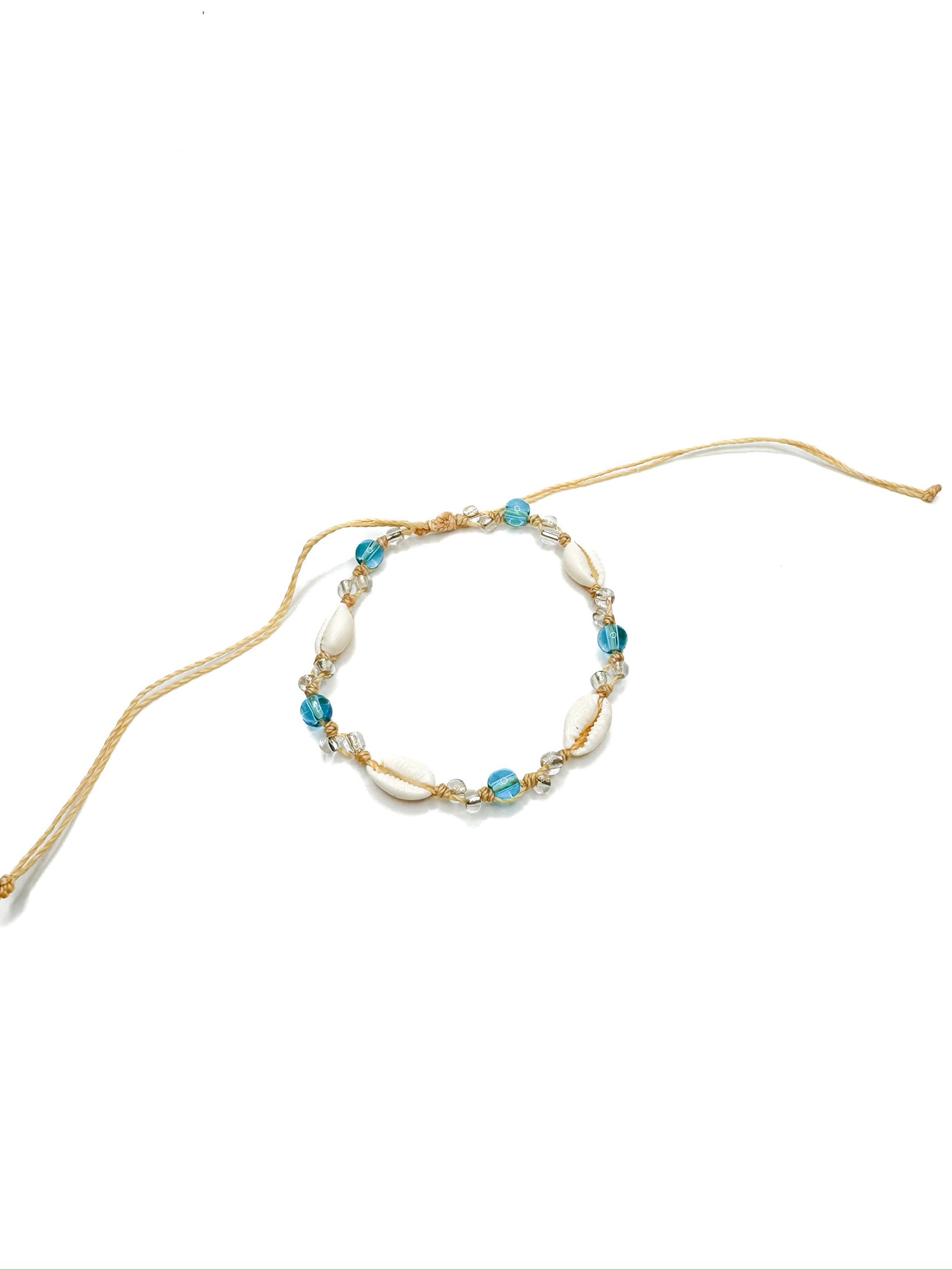 Anklet with white shells, blue beads, and clear crystals 