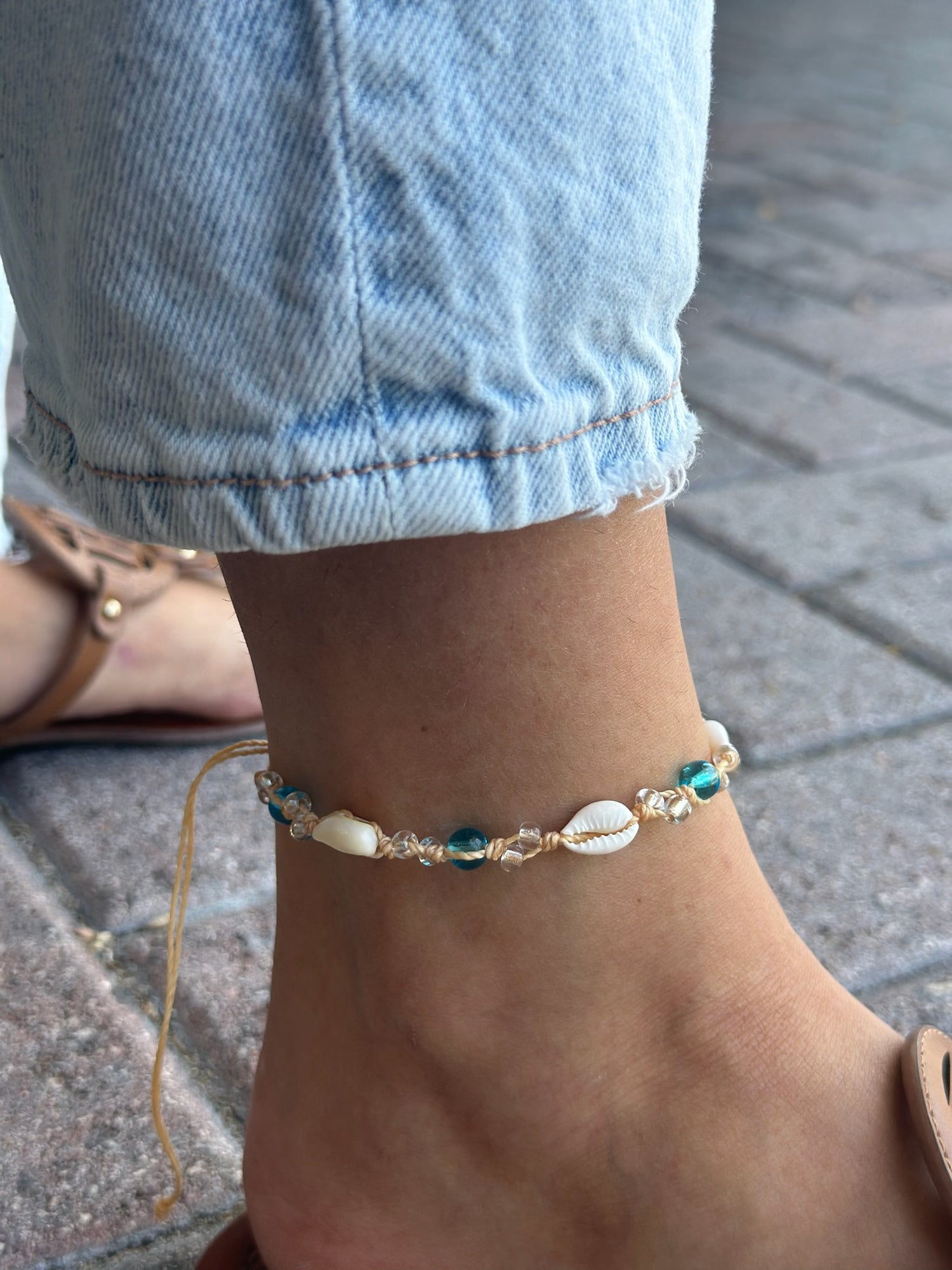 Anklet with white shells, blue beads, and clear crystals 