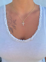 Cleo Crystal Cross Necklace from Ardor Boutique – 16.5-inch gold-filled chain with baguette-cut crystal cross pendant being worn.