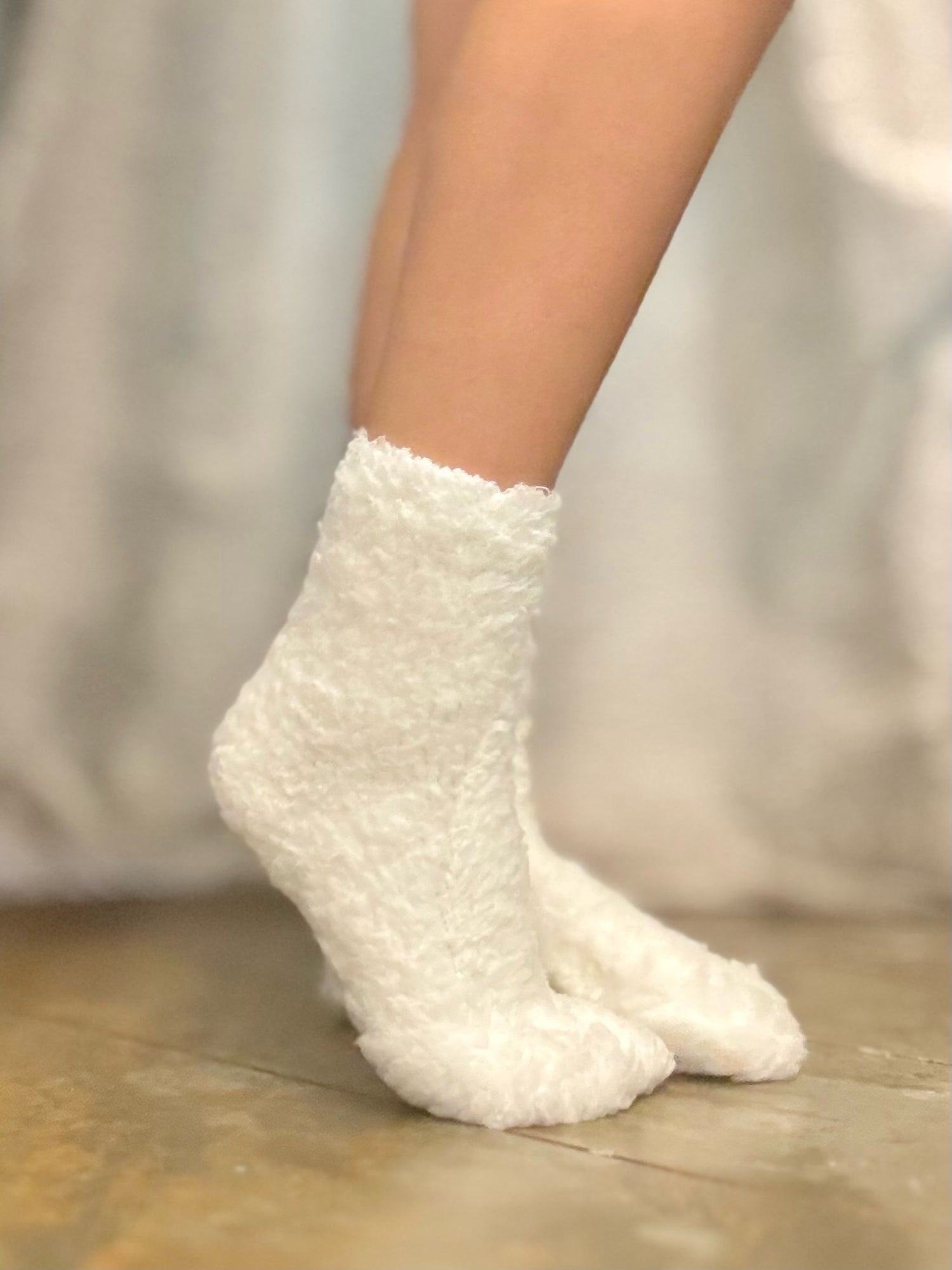 view of plush socks in ivory