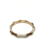 "Slim enamel bangle with bamboo-inspired gold accents"