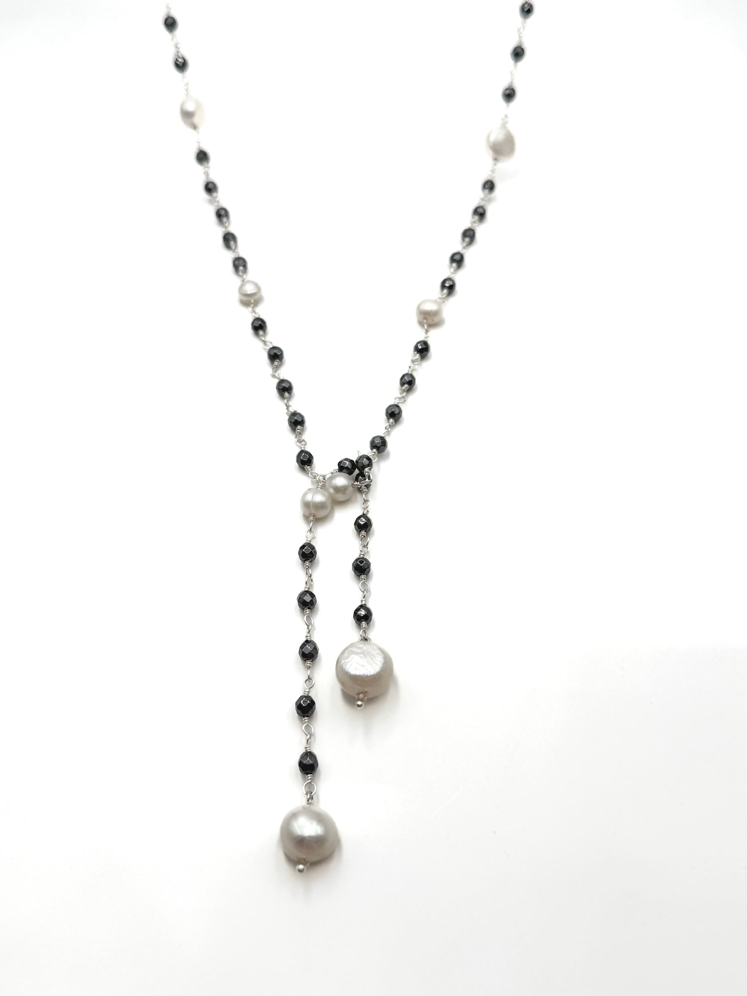 Necklace with black and white beads on a white background