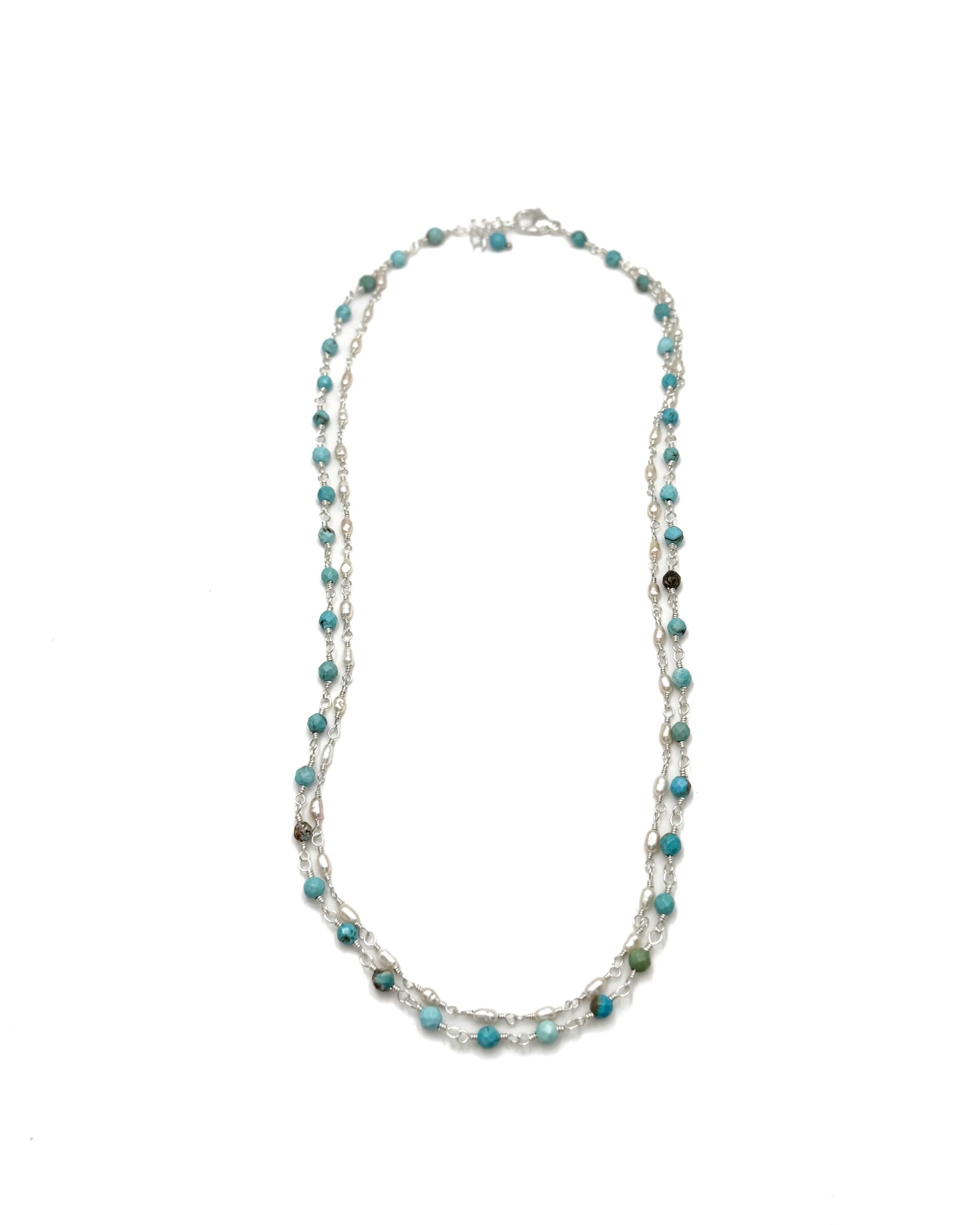 turquoise beaded necklace on a white background