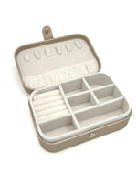 Open Elizabeth Jewelry Case in gold showing ring rolls, divided compartments, necklace hooks, and elastic pocket.