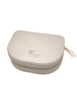 Closed pink Victoria Curved Jewelry Case with Nina Halls Jewelry logo on the lid, displayed on a clean white background.