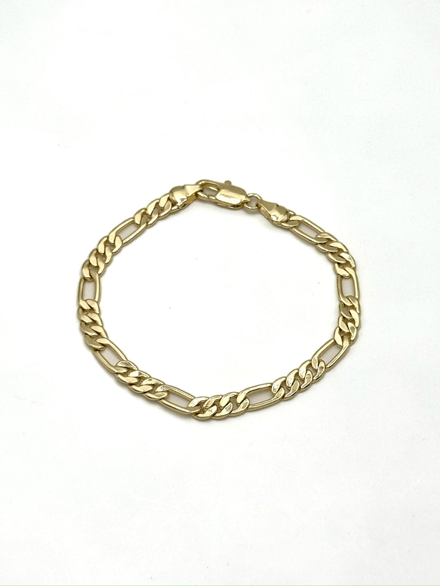 Ella Gold Chain Bracelet with flat polished gold-tone links arranged in a circle on a white background