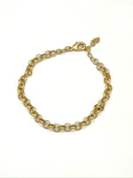 Gold chain bracelet on a white background