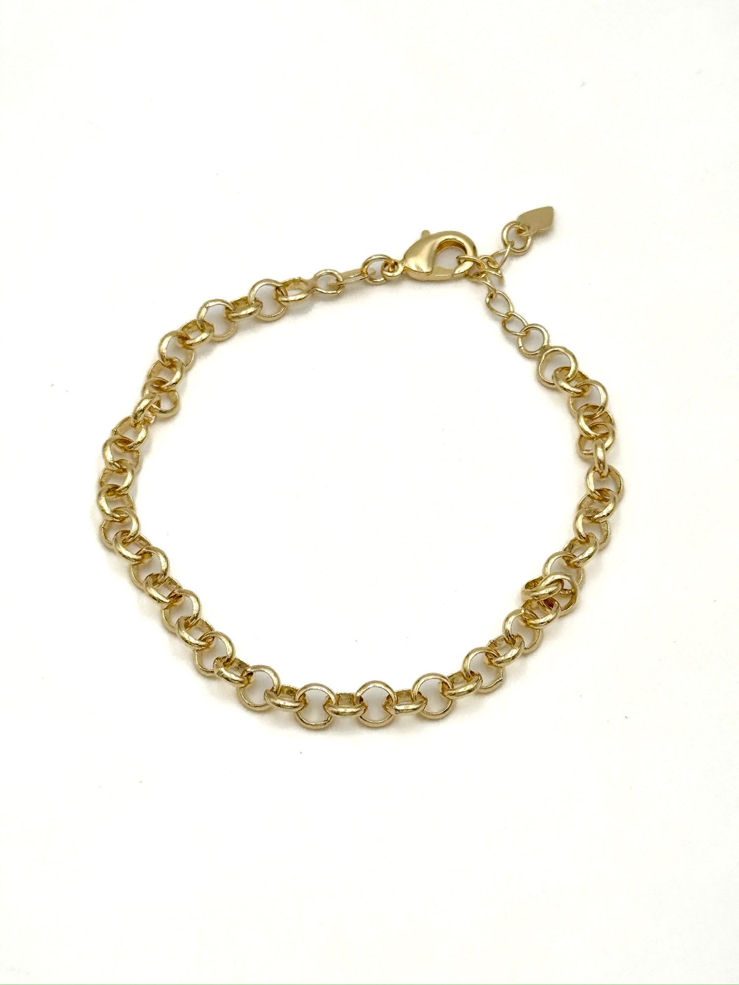 Gold chain bracelet on a white background