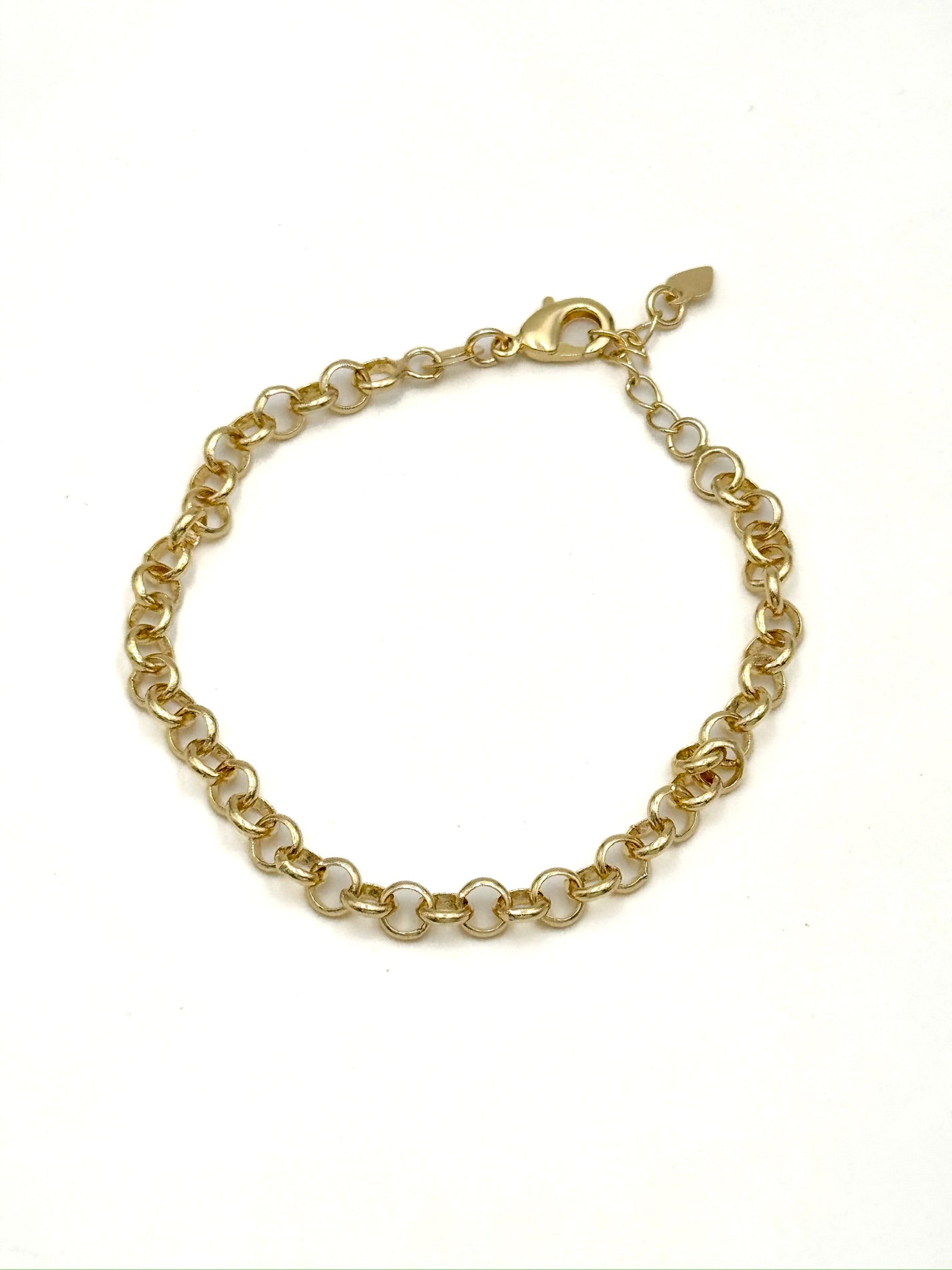 Gold chain bracelet on a white background